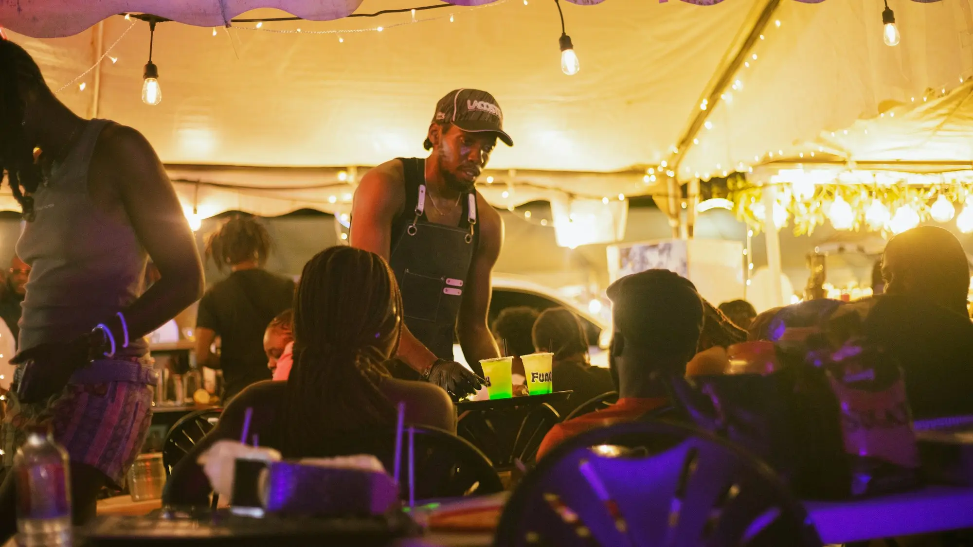 Food stall serving a crowd at a lively evening market on the Gold Coast