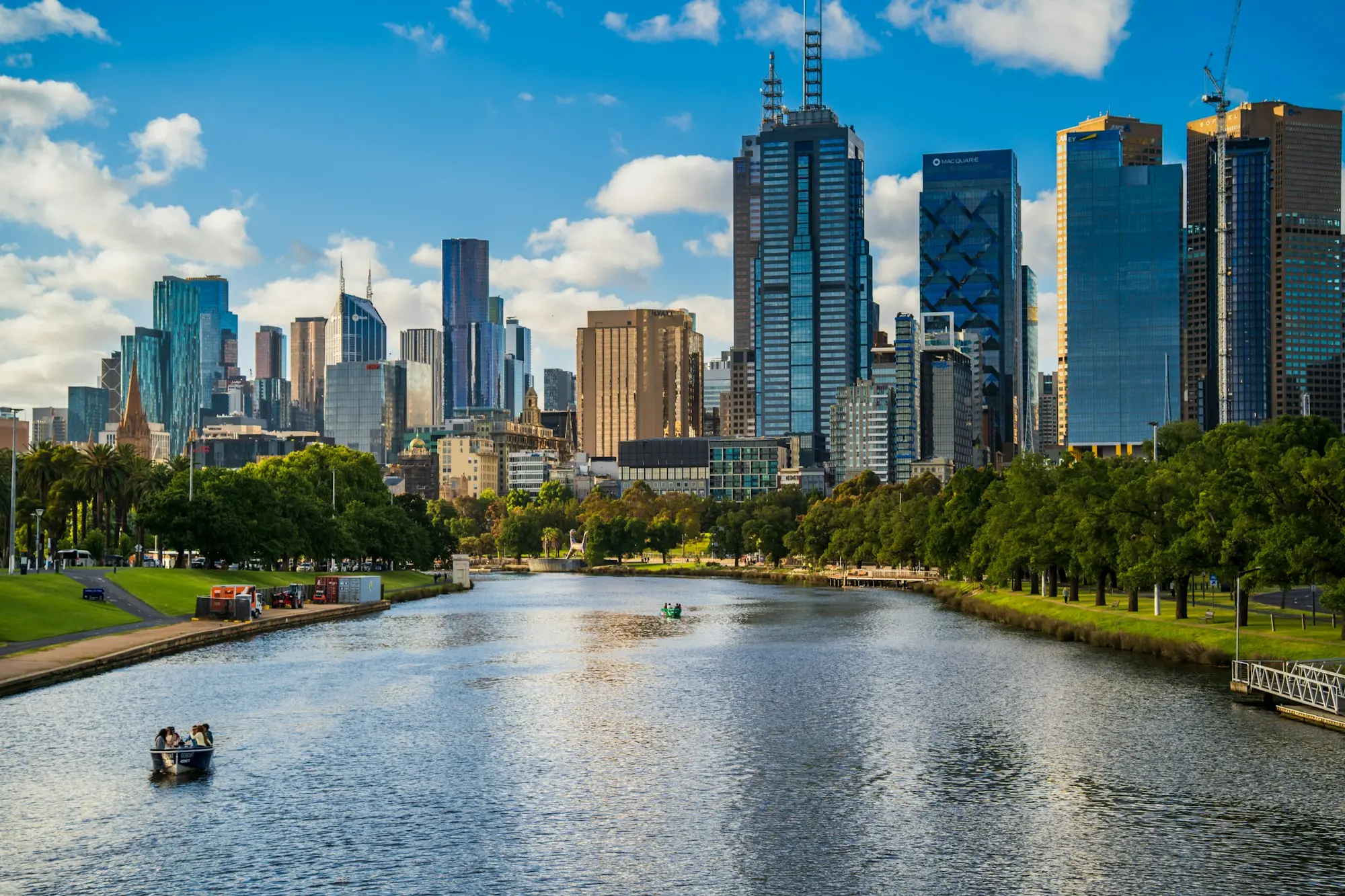 Melbourne city skyline rising beyond the Yarra River on a clear day